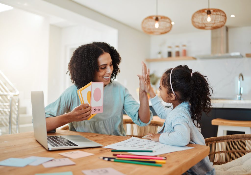 High five homework success mother with happy kid celebration learning shapes goals test quiz teamwork smile proud mom teaching kindergarten girl child with support motivation