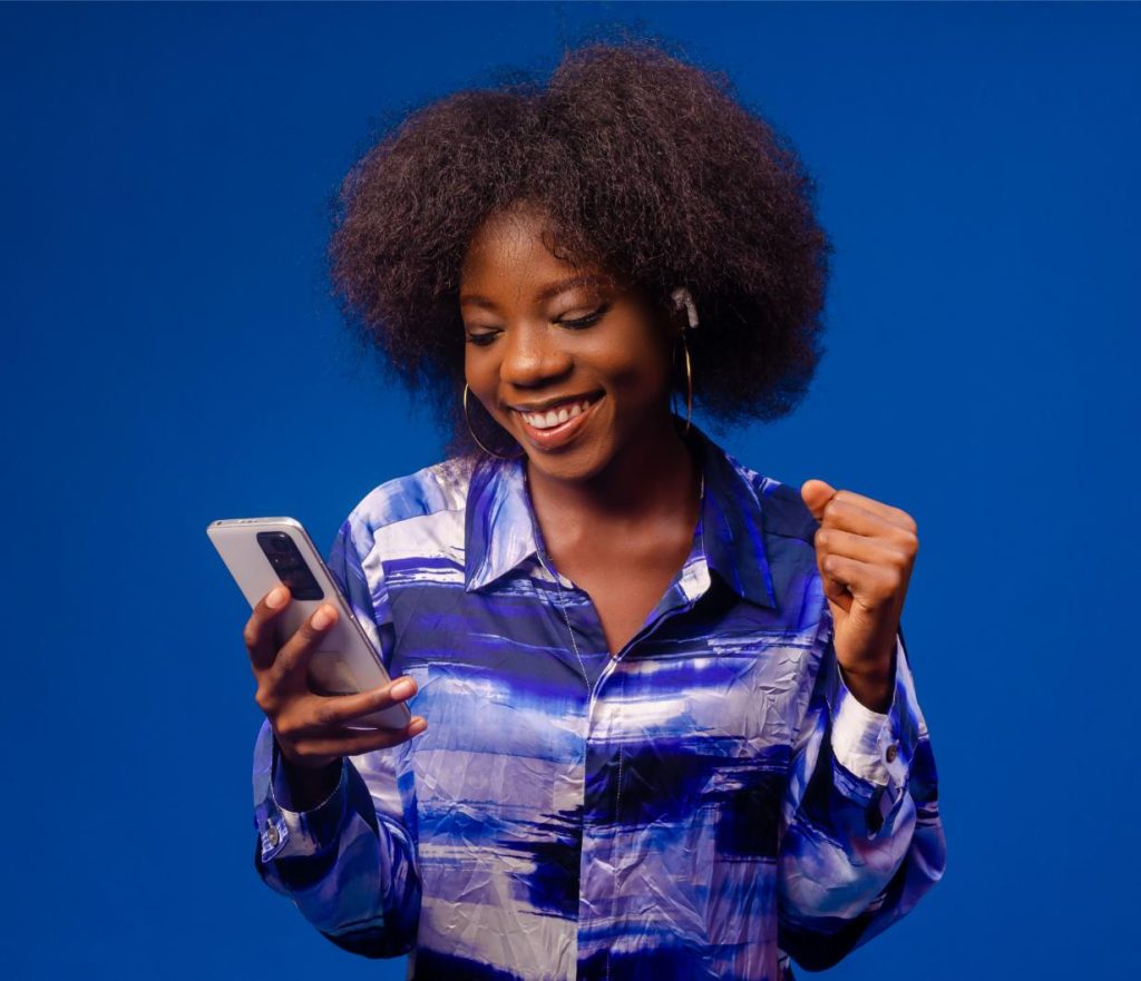 Overexcited lady looking her phone smiling
